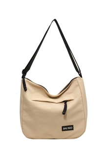 Lightweight large capacity beige canvas tote bag with adjustable black shoulder strap