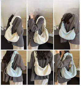 Detailed views of the pleated crescent underarm bag in cream white and light cyan colors