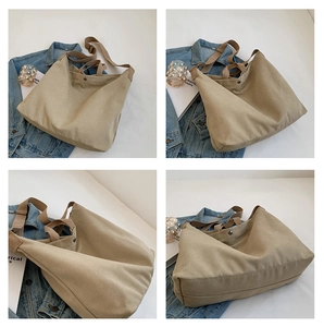 Détails du sac cabas en toile kaki montrant le fermoir magnétique et la bandoulière