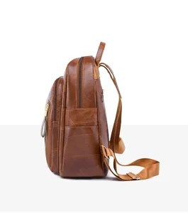 Side view of dark brown leather backpack with triple zipper compartments and side pockets