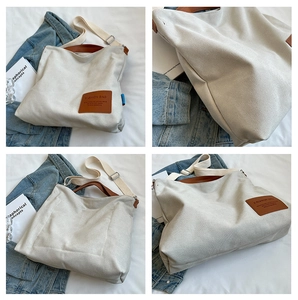 Detail view of large canvas tote bag showing front, side, back and interior storage space