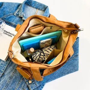 Detail view of khaki Oxford tote bag interior showing large capacity for laptop and daily items