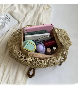 Top view of large capacity woven tote bag interior with wooden bead handle and drawstring lining