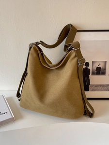 Minimalist large capacity canvas crossbody bag with adjustable strap in deep khaki
