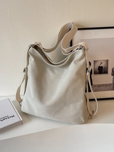 Minimalist large canvas shoulder bag in cream beige with adjustable wide strap for daily use