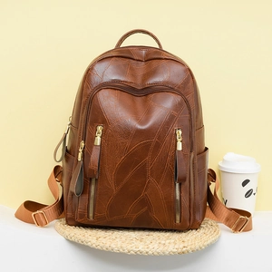 Retro brown PU leather backpack with leaf pattern and multiple gold zipper pockets