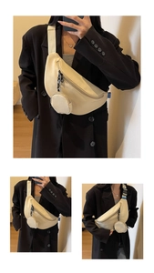 Detailed view of beige crescent canvas crossbody bag with mini round coin pouch