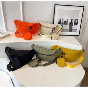 Detailed view of canvas chest bags in five colors with matching round coin purses