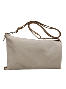 Minimalist cream canvas shoulder bag with brown adjustable strap and silver metal hooks