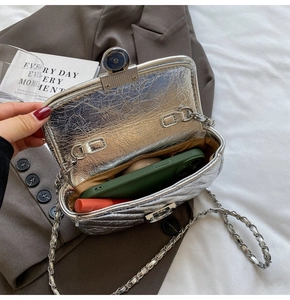 Internal view of silver quilted chain bag showing space for phone and lipstick