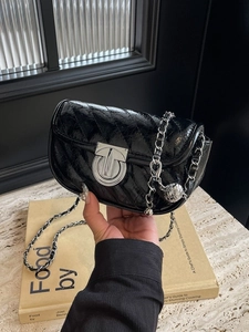 Fashionable black quilted chain shoulder bag with silver ball charm and glossy finish