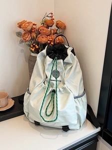 Lightweight light green outdoor drawstring backpack with tennis boy club graphic print