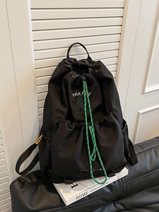 Lightweight black drawstring backpack with tennis club print and decorative green rope