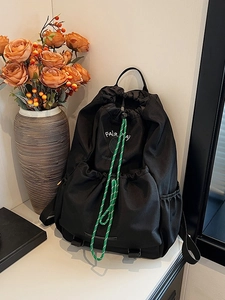 Lightweight black outdoor backpack with drawstring closure and tennis club lettering