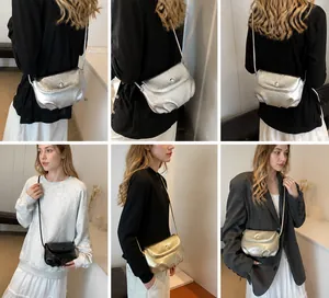 Detail shots of fashionable ruched cloud bags in silver, gold, and black metallic finishes