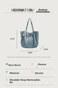 Detail view of denim tote bag with lace bow and embroidery measuring 31x30x14cm