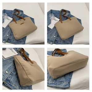 Close-up of beige tote bag showing its durable canvas texture and brown leather straps