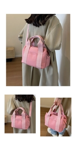Detailed views of a pink canvas tote bag showing the handles, strap, and large capacity