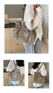 Detail of khaki corduroy tote bag featuring drawstring closure and functional front flap pocket