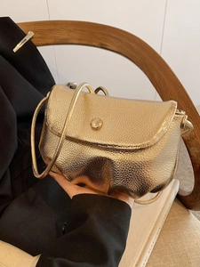Chic gold ruched cloud bag with lychee texture and metallic magnetic clasp