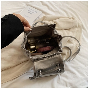 Detail view of silver backpack interior with drawstring closure and large capacity