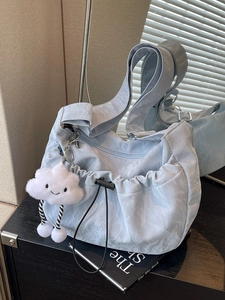 Light blue ruched shoulder bag with cute cloud plush charm and adjustable side drawstrings