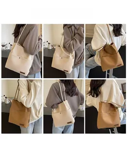Detail shots of beige and caramel large canvas tote bag with slim faux leather straps