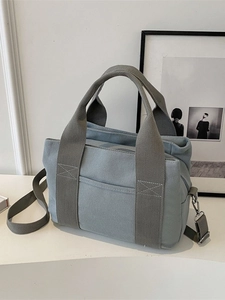 Minimalist large capacity canvas tote bag with adjustable shoulder strap for women