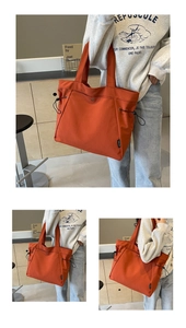 Detail of adjustable drawstring on orange canvas tote bag with side woven label
