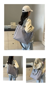 Close-up of a Morandi grey large tote bag with wide shoulder straps and side pockets