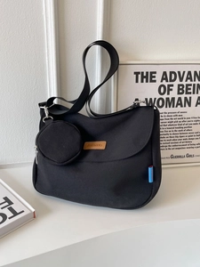 Retro black canvas crossbody bag with mini pouch and vintage commuter style