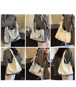 Detailed views of high-capacity silver and cream shoulder bags on a model