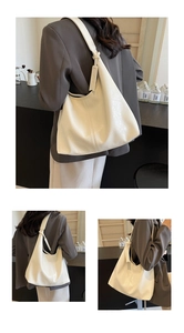 Detail shots of large cream tote bag showing soft leather texture and stylish slouchy fit