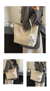 Close-up of beige tote bag featuring quilted diamond stitching and cute cloud charm detail