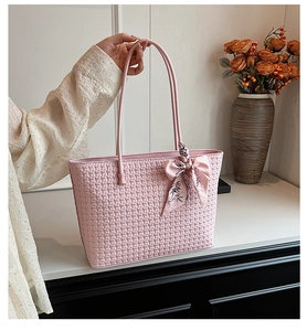 Pink woven tote bag with printed silk scarf detail and textured checkerboard pattern