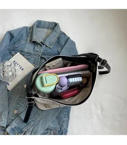 Top-down view of large canvas tote bag showing spacious interior with daily essentials