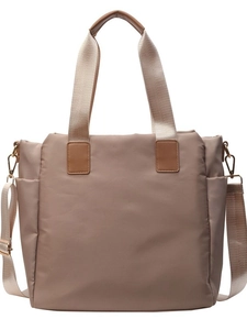 Chic beige nylon tote bag with leather handles and adjustable woven shoulder strap