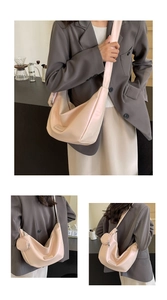 Detail of pink hobo bag with wide shoulder strap and detachable round coin purse