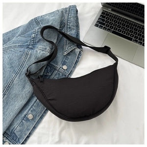 Top view of black crescent dumpling bag made of nylon fabric with an adjustable strap