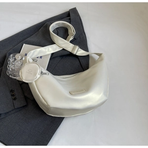 Chic cream-white half-moon bag featuring a matching wide strap and mini round coin purse