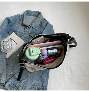 Spacious interior of off-white canvas tote showing capacity for daily essentials