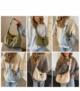 Detail view of ruched shoulder bag texture and adjustable strap in multiple colors