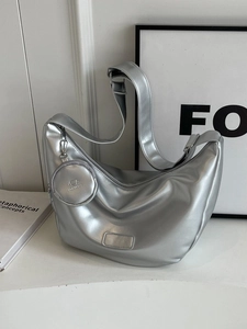 Silver crescent shoulder bag with adjustable strap and detachable round coin purse charm