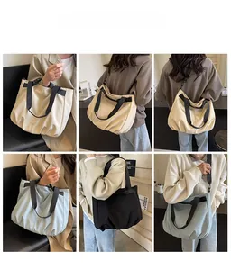 Detailed views of high-capacity canvas tote bag showing hand-carry and crossbody styles