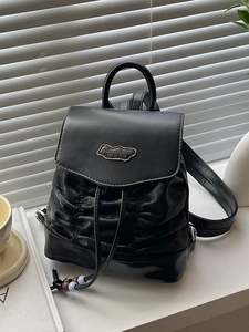 Chic black pleated mini backpack in velvet and leather finish with metal logo detail