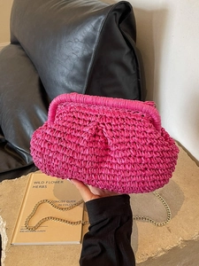 Hot pink straw cloud clutch bag with gold chain strap for summer beach vacations