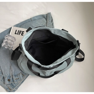 Top-down view showing the large capacity interior and zipper pocket of this blue tote bag