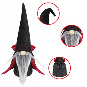 Detail view of Halloween vampire gnome with red-lined cape and silver spider web pattern