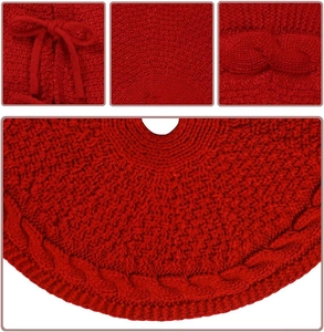 Detail of red cable knit Christmas tree skirt showing bow ties and braided textures