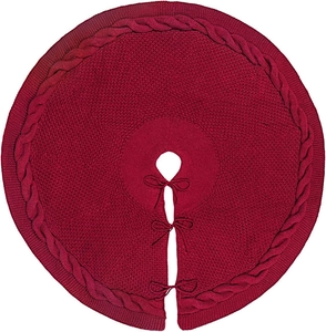 Detail of burgundy cable knit Christmas tree skirt with decorative bow tie closures